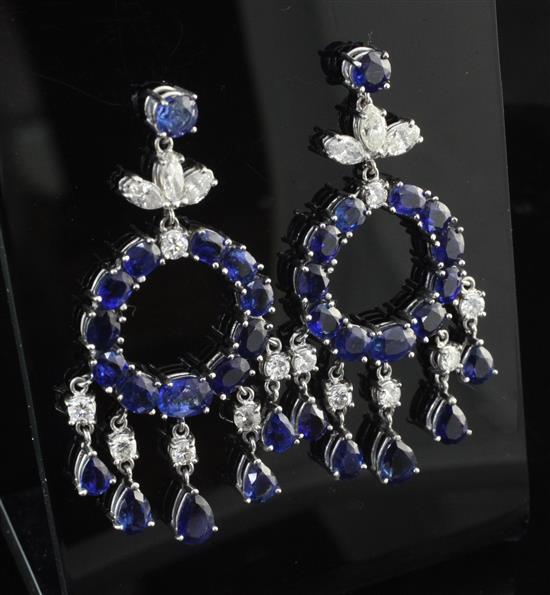 A pair of ornate white gold, sapphire and diamond drop earrings, overall 2in.